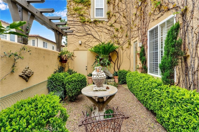 view of patio / terrace featuring fence and a pergola