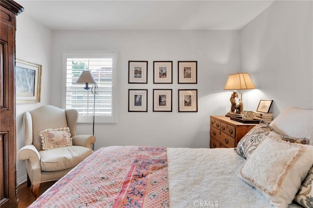 bedroom with wood finished floors