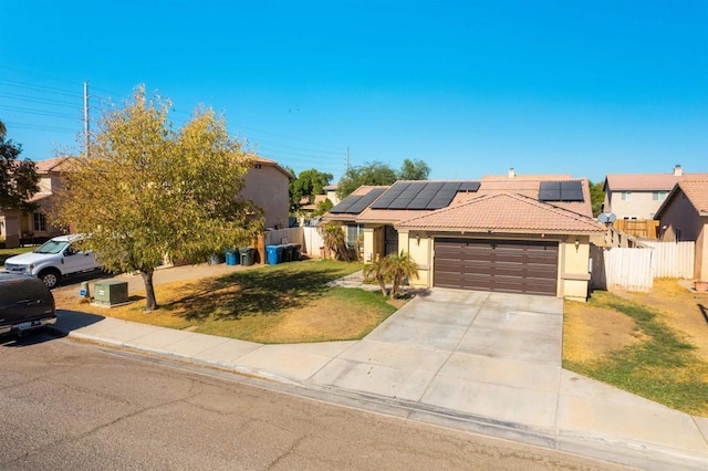 731 River Dr, Brawley, CA 92227 - view of front of house featuring stucco siding, a tile roof, a garage, and solar panels