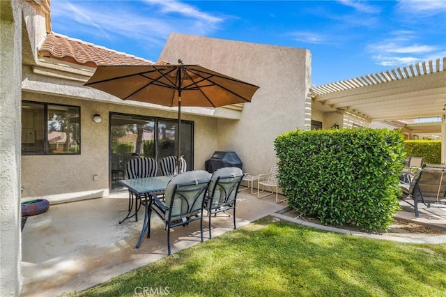 view of patio / terrace featuring a pergola and outdoor dining area
