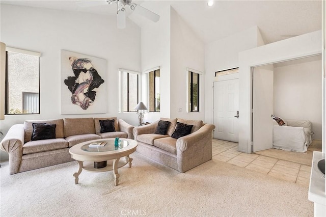 living room with high vaulted ceiling, tile patterned flooring, and a ceiling fan