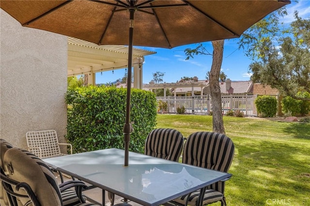 view of patio featuring a pergola, outdoor dining space, and fence