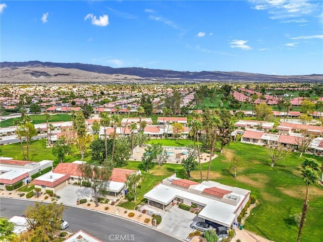 birds eye view of property with a residential view and a mountain view