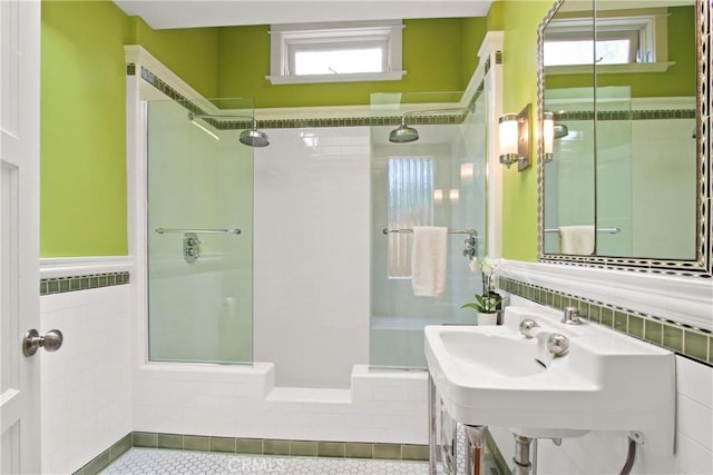 336 Redwood Dr, Pasadena, CA 91105 - bathroom with a tile shower, plenty of natural light, tile patterned floors, and tile walls