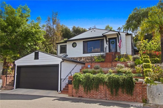 336 Redwood Dr, Pasadena, CA 91105 - view of front of property featuring an attached garage, stone siding, and an outdoor structure