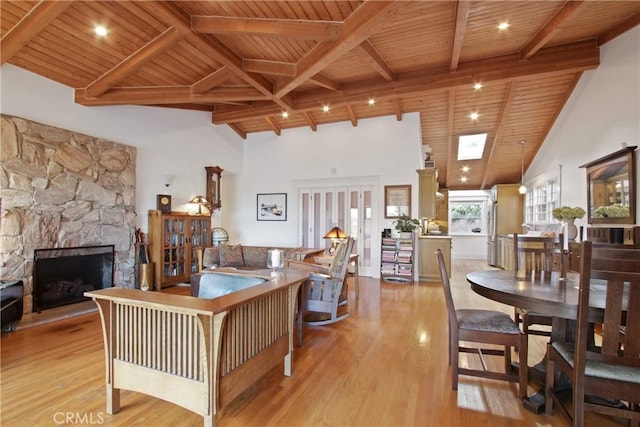 336 Redwood Dr, Pasadena, CA 91105 - living room featuring a wooden ceiling with exposed beams, wood finished floors, a stone fireplace, and high vaulted ceiling