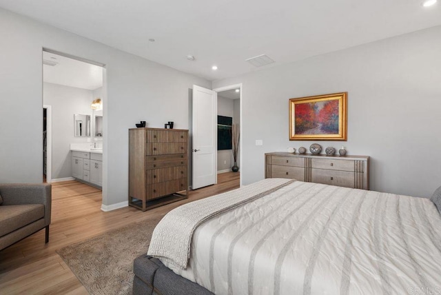 1518 Pepperwood Way, Oceanside, CA 92056 - bedroom featuring light wood finished floors, recessed lighting, connected bathroom, and baseboards