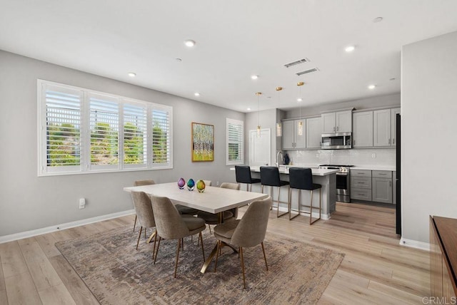 1518 Pepperwood Way, Oceanside, CA 92056 - dining room featuring light wood finished floors and recessed lighting