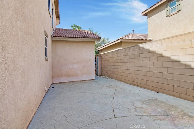 view of patio featuring fence