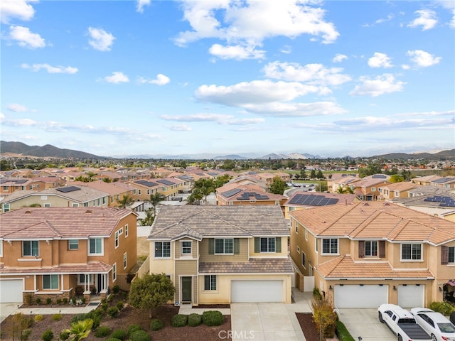 drone / aerial view with a mountain view and a residential view