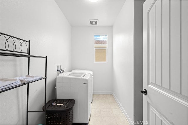 laundry room with visible vents, baseboards, separate washer and dryer, and laundry area