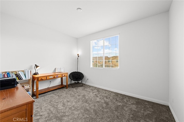 home office with baseboards and carpet floors