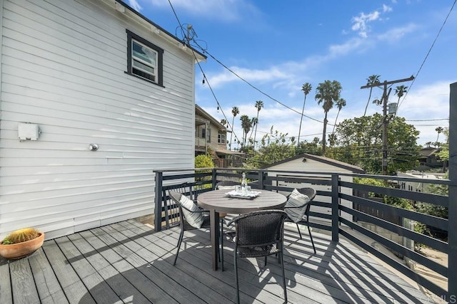deck featuring outdoor dining area