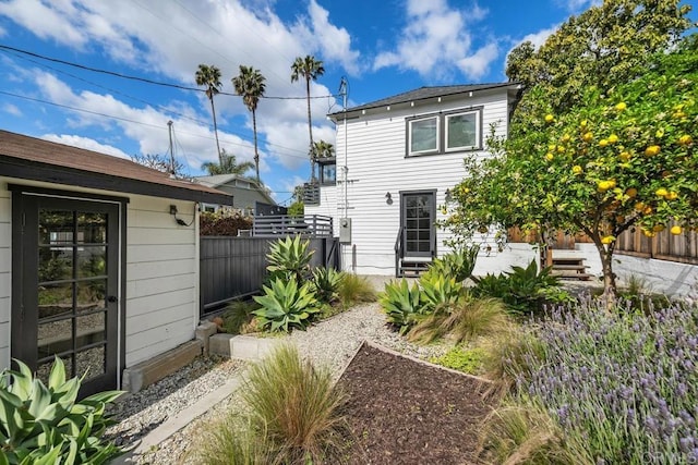 rear view of property with fence