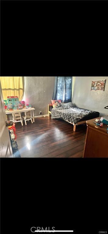 713 Charlana Dr, Bakersfield, CA 93308 - unfurnished bedroom featuring wood finished floors