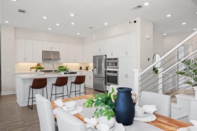 108 Shear, Irvine, CA 92618 - dining room featuring stairway, wood finished floors, and recessed lighting