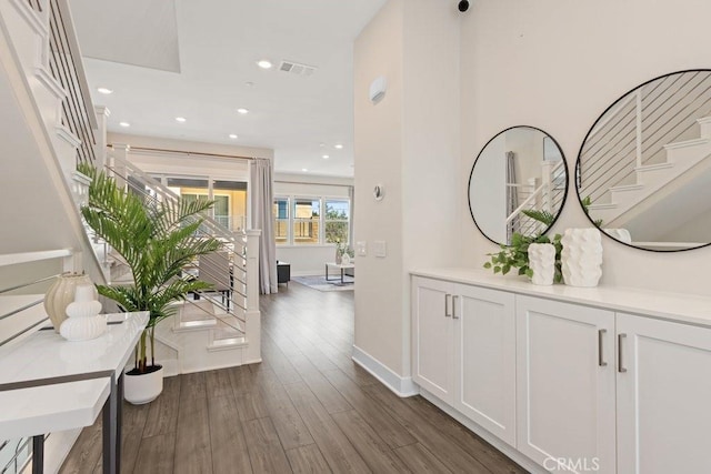 108 Shear, Irvine, CA 92618 - hallway with stairway, dark wood-type flooring, recessed lighting, and baseboards