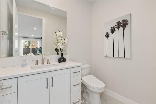 108 Shear, Irvine, CA 92618 - bathroom with toilet, vanity, and baseboards