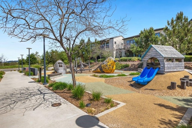view of community featuring playground community