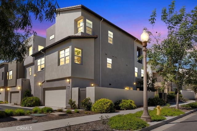 108 Shear, Irvine, CA 92618 - view of home's exterior featuring an attached garage, fence, and stucco siding
