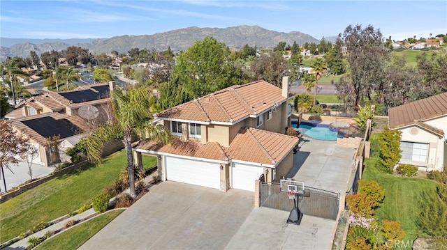 6816 Ridgeside Dr, Riverside, CA 92506 - aerial view of residential area featuring mountains and a pool area