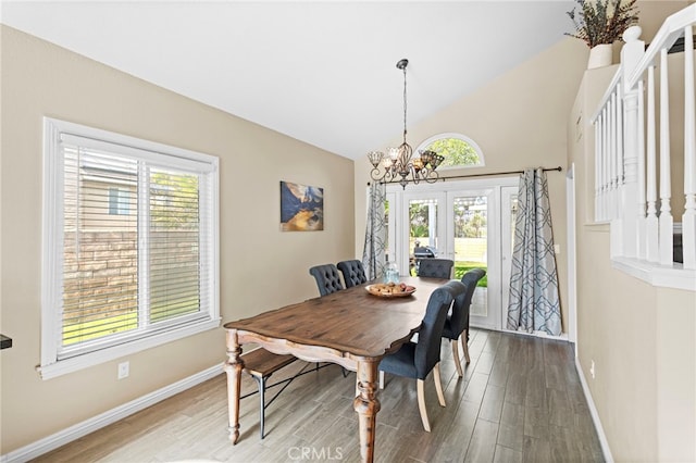 6816 Ridgeside Dr, Riverside, CA 92506 - dining area with baseboards, a chandelier, wood finished floors, high vaulted ceiling, and stairs