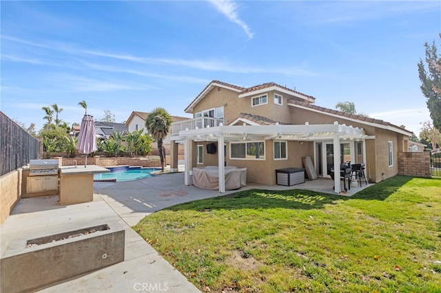 6816 Ridgeside Dr, Riverside, CA 92506 - rear view of house with a hot tub, a pergola, a patio area, and stucco siding