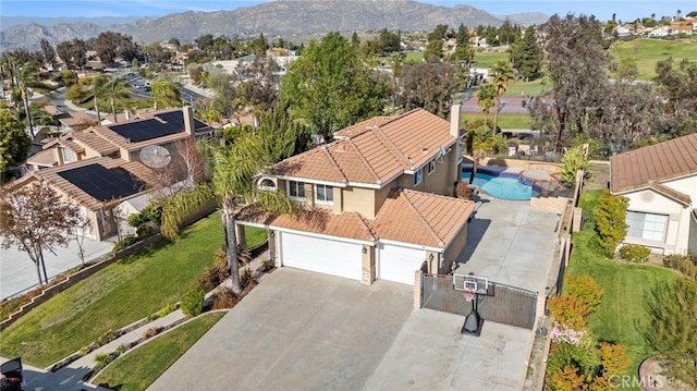 6816 Ridgeside Dr, Riverside, CA 92506 - aerial perspective of suburban area featuring a mountain backdrop