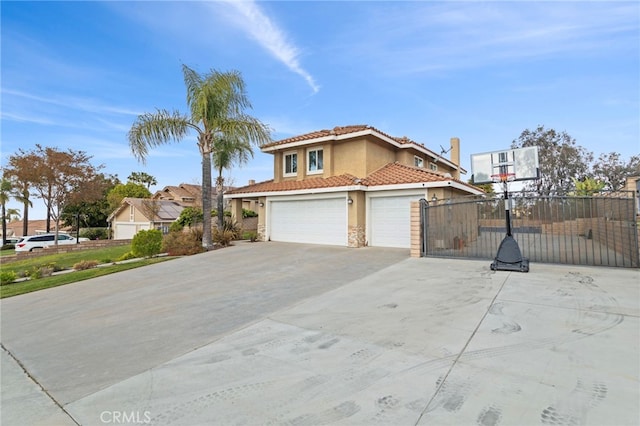 6816 Ridgeside Dr, Riverside, CA 92506 - view of front of home with stucco siding, fence, a tile roof, concrete driveway, and stone siding