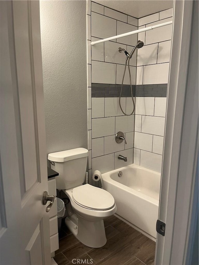 6816 Ridgeside Dr, Riverside, CA 92506 - full bath with a textured wall, wood finished floors, toilet, and shower / bathtub combination