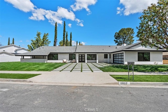 2037 Rayshire St, Thousand Oaks, CA 91362 - ranch-style home with a garage, a front lawn, french doors, stucco siding, and concrete driveway