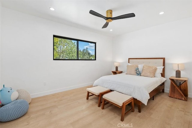 bedroom featuring recessed lighting, baseboards, ceiling fan, and light wood-type flooring