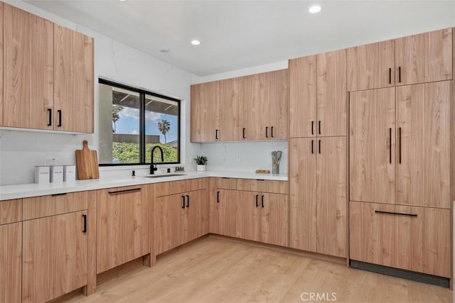 2037 Rayshire St, Thousand Oaks, CA 91362 - kitchen with a sink, light brown cabinetry, light countertops, light wood-style floors, and recessed lighting