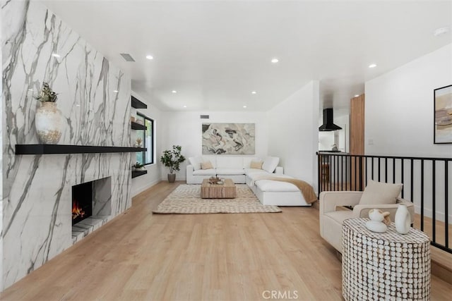 2037 Rayshire St, Thousand Oaks, CA 91362 - living room with wood finished floors, a high end fireplace, and recessed lighting