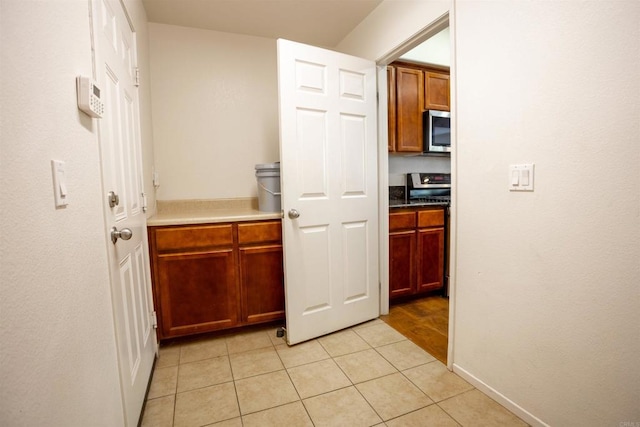 422 Cool Creek Ct Unit 5, Brawley, CA 92227 - corridor with light tile patterned floors and baseboards
