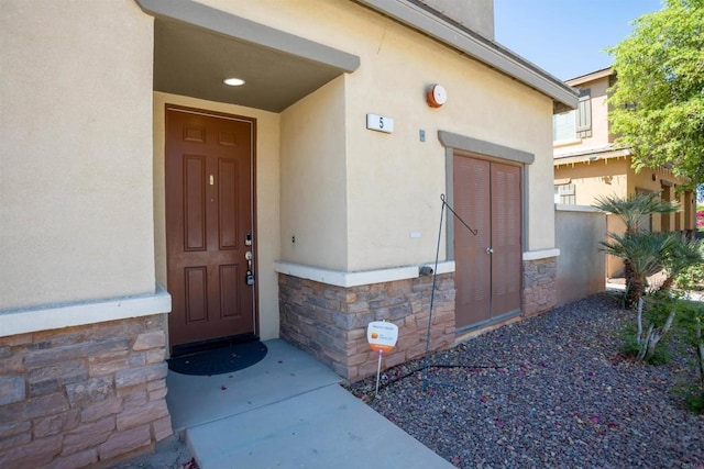 422 Cool Creek Ct Unit 5, Brawley, CA 92227 - doorway to property with stone siding and stucco siding