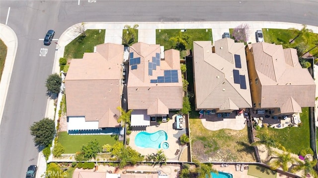 birds eye view of property with a residential view