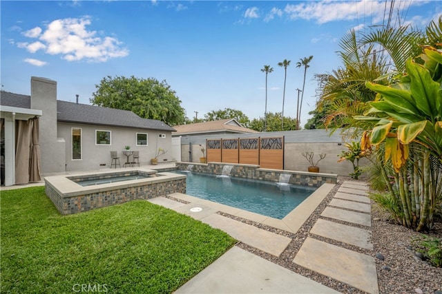 view of pool with a pool with connected hot tub, a patio area, a lawn, and a fenced backyard