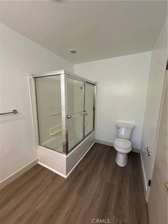22423 Macfarlane Dr, Woodland Hills, CA 91364 - bathroom featuring baseboards, toilet, a shower with door, and wood finished floors