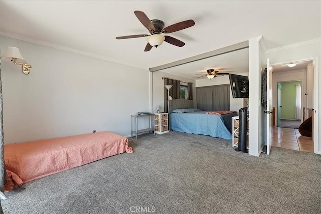unfurnished bedroom featuring ceiling fan, ornamental molding, and carpet