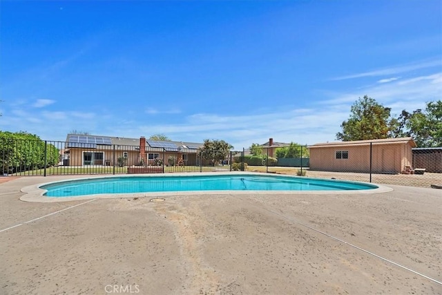 view of swimming pool with fence, a fenced in pool, and a patio