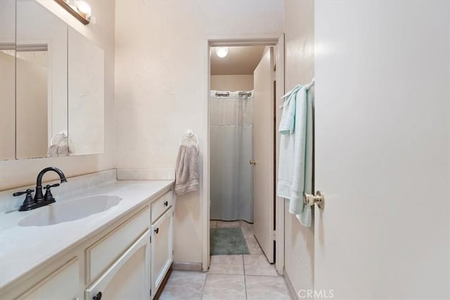 full bathroom with vanity and tile patterned flooring