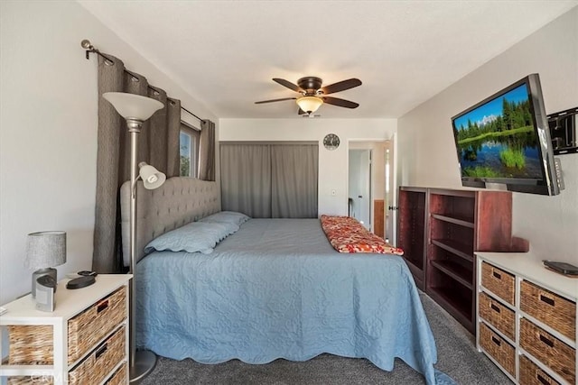 bedroom with a ceiling fan and carpet flooring