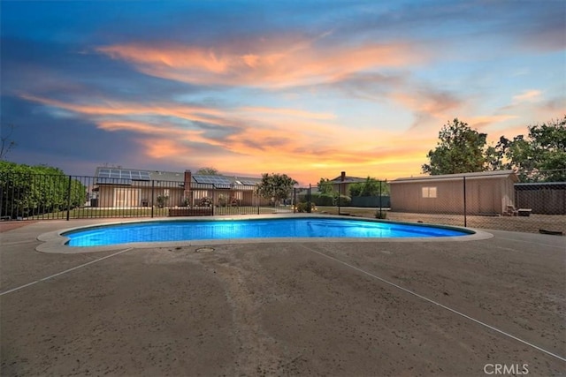 view of pool with fence, a fenced in pool, and a patio