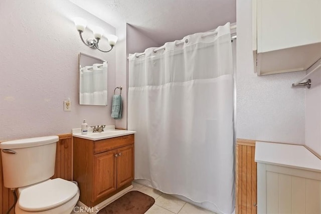 full bath featuring toilet, tile patterned floors, a shower with shower curtain, and vanity