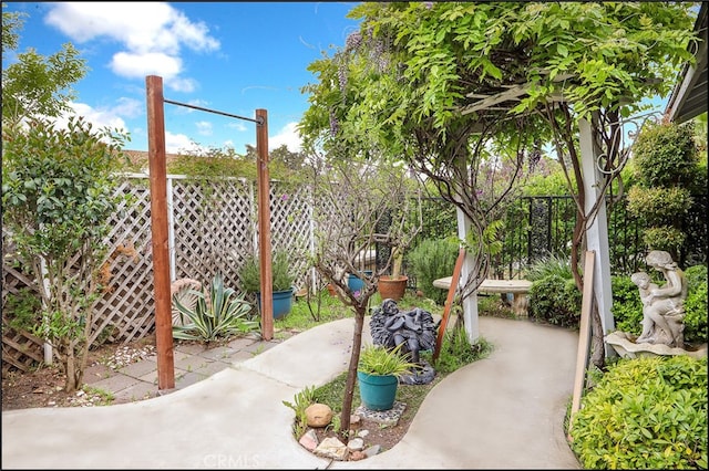 view of patio featuring fence