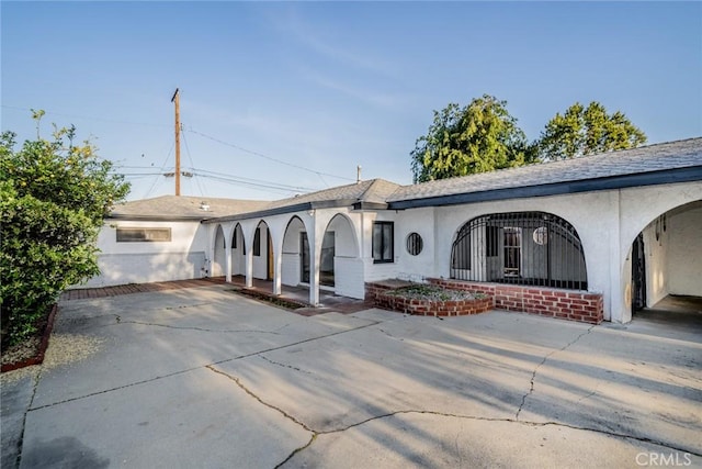 932 S Bon View Ave, Ontario, CA 91761 - ranch-style home featuring stucco siding, driveway, and covered porch