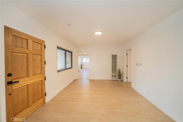 932 S Bon View Ave, Ontario, CA 91761 - hallway with a heating unit and light wood-style floors