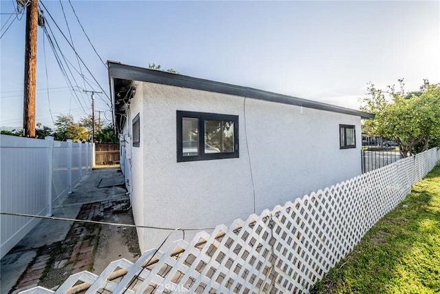 932 S Bon View Ave, Ontario, CA 91761 - view of home's exterior featuring stucco siding and a fenced backyard