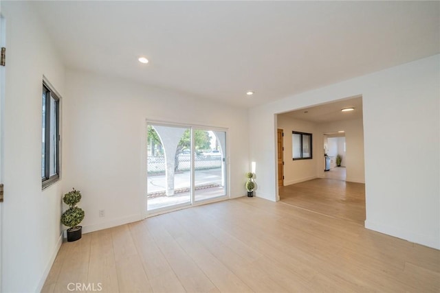 932 S Bon View Ave, Ontario, CA 91761 - unfurnished living room with light wood-style flooring and recessed lighting